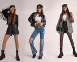Trzy kobiety w stylizacjach grunge: skórzane szorty, podarte jeansy, ramoneska, marynarka w kratę, czapki i ciężkie buty.