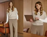 Elegancki strój damski: beżowy sweter bez rękawów na białej bluzce, brązowe spodnie. Kobieta z laptopem.