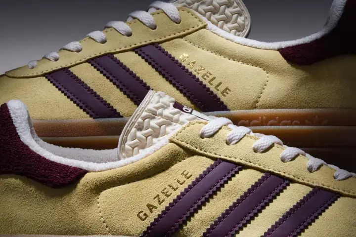 Żółte **modele butów adidas z lat 90.** Gazelle z bordowymi paskami i białymi sznurówkami.